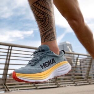 Hoka Men's Grey Running Shoes with Yellow Midsole and Orange Toe Cap